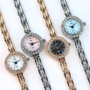 Elegant women's quartz bracelet watches featuring rhinestone bezels in four color variants