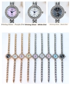 Detailed close-up of quartz bracelet watch set with rhinestone bezel and metal straps