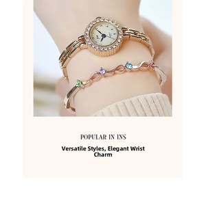 Macro detail of rose gold quartz watch with rhinestone bezel and colorful gem bracelet