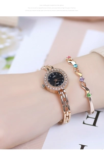 Close-up of rose gold rhinestone watch and matching wave bangle on model wrist