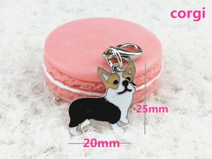 Macro view of a 20x25mm metal Corgi keychain pendant with colorful enamel details