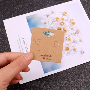 Brown kraft paper earring display cards featuring Handmade with love and red heart print