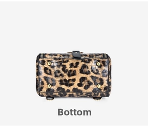 Detailed bottom view of leopard print PU leather bag with golden metal protective feet