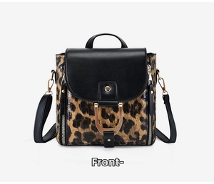 Detail of leopard print PU leather bag with golden horseshoe buckle and black flap cover