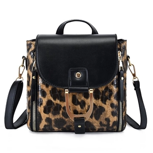 Detail showing leopard print texture and metal hardware on PU leather shoulder bag
