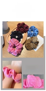 Detailed view of high-elasticity corduroy scrunchies in various vintage colors