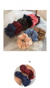 Detailed view of multi-color corduroy hair scrunchies with thick ribbed velvet texture