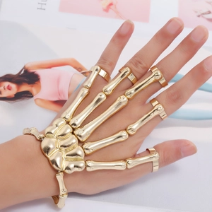Gold skeleton hand bracelet gothic punk adjustable armor knuckle ring fashion accessory.