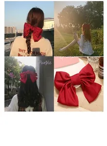 Detail view of large red matte silk bow hair clip shown on model and close-up