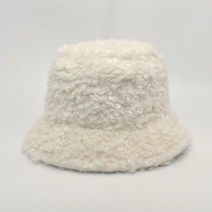 Close-up of thick white faux shearling bucket hat showcasing soft curly fleece texture