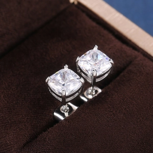Detailed view of square-cut cubic zirconia stud earrings in a classic four-prong setting