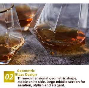 Close-up of geometric faceted glass with gold rim design for whiskey and wine decanting