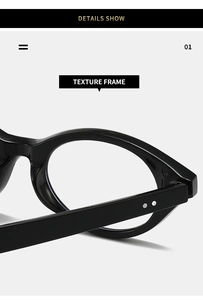 Detail showing high-gloss black oval eyeglass frame with metallic rivet hinges