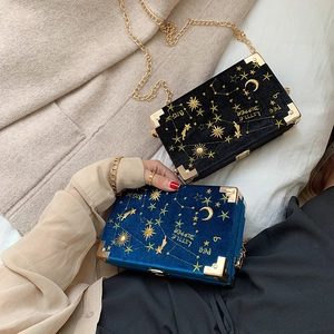 Navy and black velvet box clutch with gold star embroidery and metal chain strap