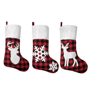 Set of 3 red and black plaid Christmas stockings with white fur trim and reindeer motifs