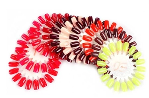 Detail view of round nail color display wheels showing glossy polish palette samples