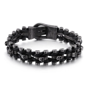 Punk men's braided leather bracelet featuring silver stainless steel skulls and buckle