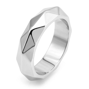 Detail view of mirror-polished silver titanium steel ring with geometric faceted cut edges