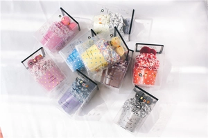 Close-up of thick coral fleece cake socks in colorful gift box packaging