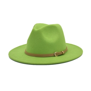 Detail of emerald green felt fedora with a brown leather belt and golden metal buckle