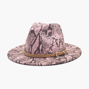 Detailed view of pink and grey snake skin pattern fedora hat with brown leather buckle strap