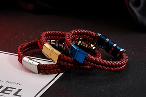 Close-up of double-layer red braided leather bracelets with gold, silver and blue magnetic clasps