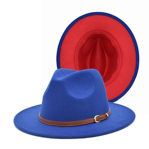 Detail of blue and red wool fedora hat featuring a brown leather band and gold buckle
