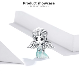 Macro shot of S925 silver fairy charm with light blue enamel wings and dress detail