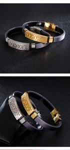 Dettaglio dei bracciali XOXO in acciaio inossidabile nelle finiture oro e argento