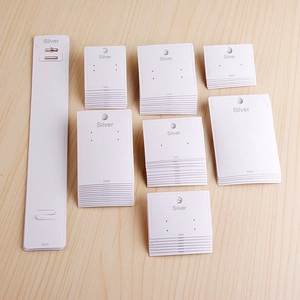 White textured jewelry display cards for earrings and necklaces with Silver S925 labels