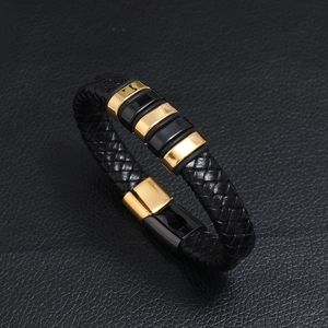 Men's braided black leather bracelet with two-tone gold magnetic clasp in 45-degree view