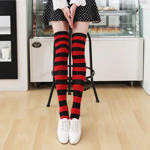 Over-the-knee socks with red and black horizontal stripes in a punk college style