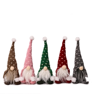 Set of five knitted Christmas gnomes with heart pattern hats and long white beards