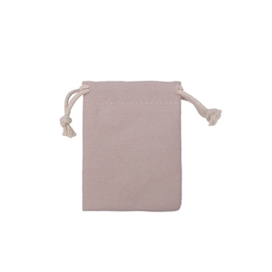 Close-up of pink cotton drawstring gift bag showing natural fabric texture and rope detail