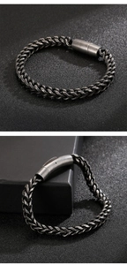 Close-up of retro stainless steel woven chain bracelet with cylindrical magnetic clasp