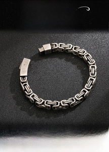 Detailed macro view of vintage Byzantine chain link design in retro silver stainless steel