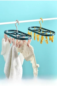 Detail of pink and yellow 12-clip drying rack for socks and small laundry items