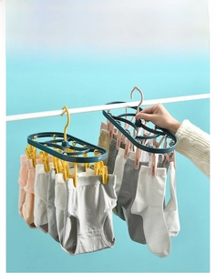 Detail of multi-clip laundry drying rack with windproof hook and durable plastic clips