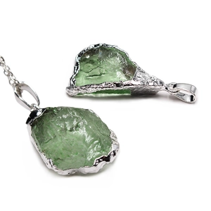 Irregular green natural crystal stone pendants with silver electroplated edges shown in two views