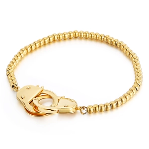 Polished gold stainless steel beaded bracelet featuring a unique handcuff clasp design