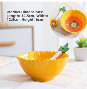 Close-up of a sunflower ceramic bowl and leaf spoon with dimension 12.5x6cm