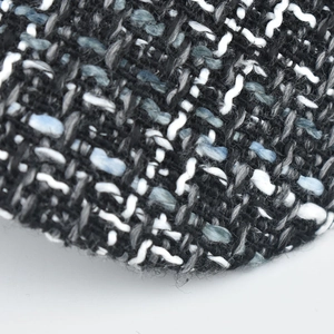 Macro shot of high-quality black and blue tweed fabric texture on wool military cap