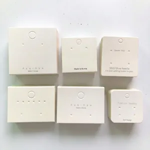 Various white jewelry display cards for earrings and necklaces with S925 silver needle text