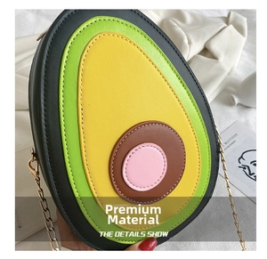 Close-up of avocado-shaped chain bag showing textured PU leather and neat stitching