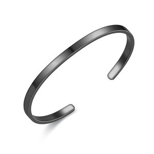 Detail view of a minimalist black stainless steel C-shaped cuff bracelet with matte finish