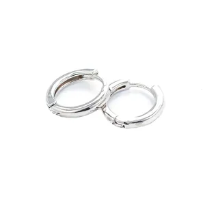 Detailed view of silver hoop earrings with micro-inlaid cubic zirconia and hinged clasp