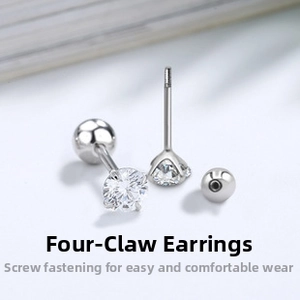 Macro detail of S925 sterling silver four-prong stud earrings with screw-back closure