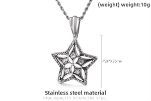 Macro shot of stainless steel star pendant with crystals and vintage engraving