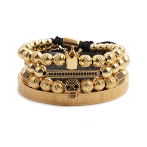 4-piece gold bracelet set with Roman numerals, crown, skull charms and black crystals
