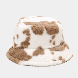 Close-up of thick plush texture and brown cow print on this warm winter bucket hat